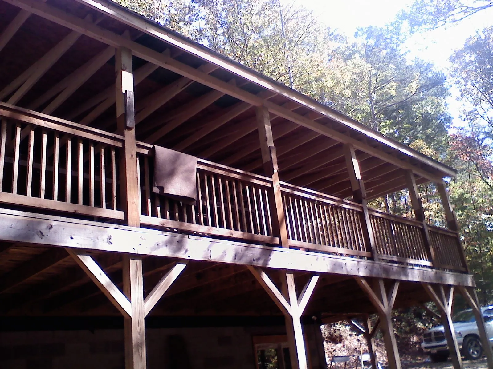 Timber framing under a new elevated porch and deck — Roof Leak Repair in Spring by Roofing Brothers